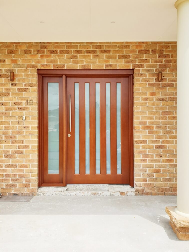 Frosted Glass Entry Door with matching sidepanel stained dark maple with vertical glass panels