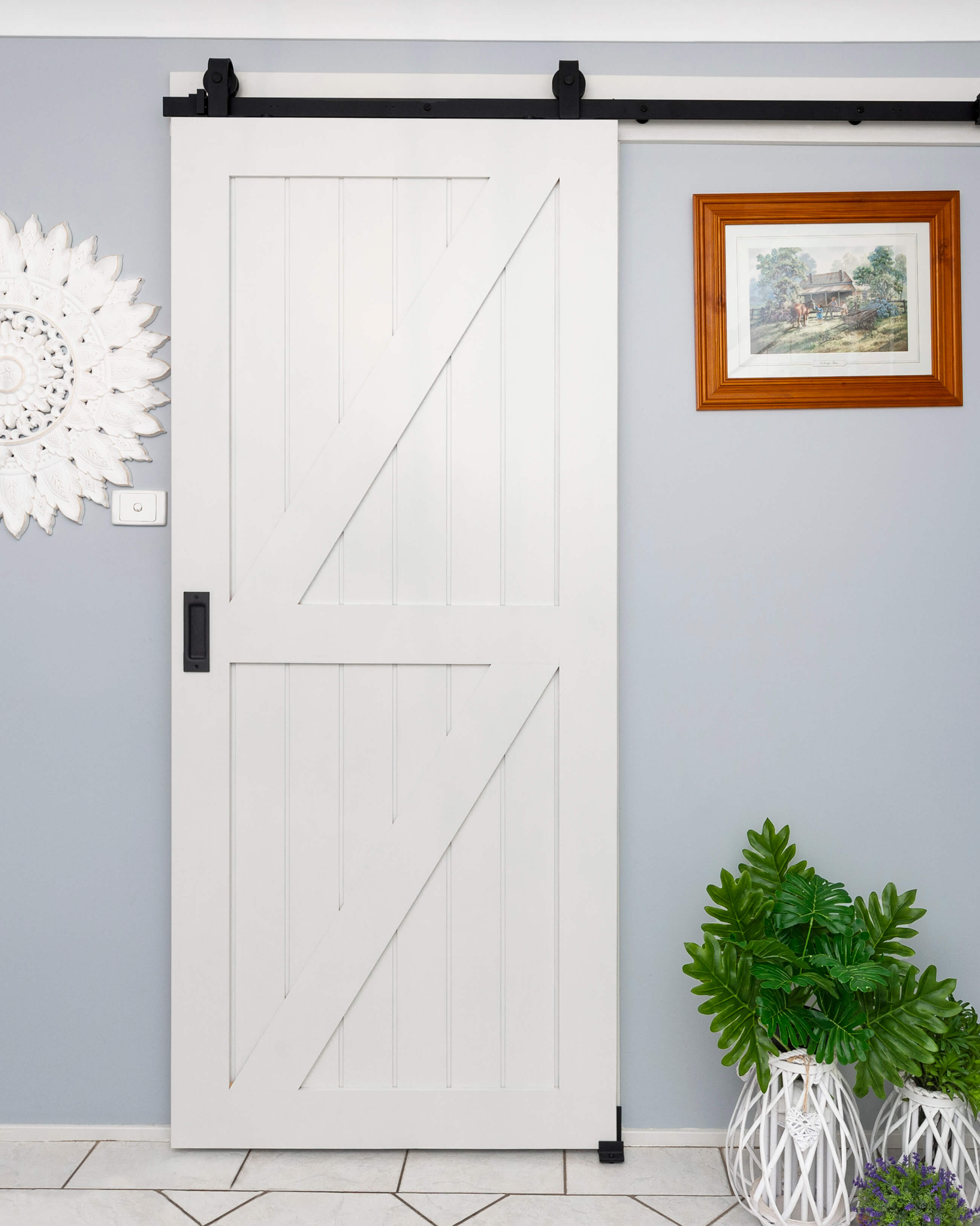 Doors Plus-Internal-Solid timber-Glengary Barn Sliding door-in painted white finish-with Black Barn tracks and fittings-laundry