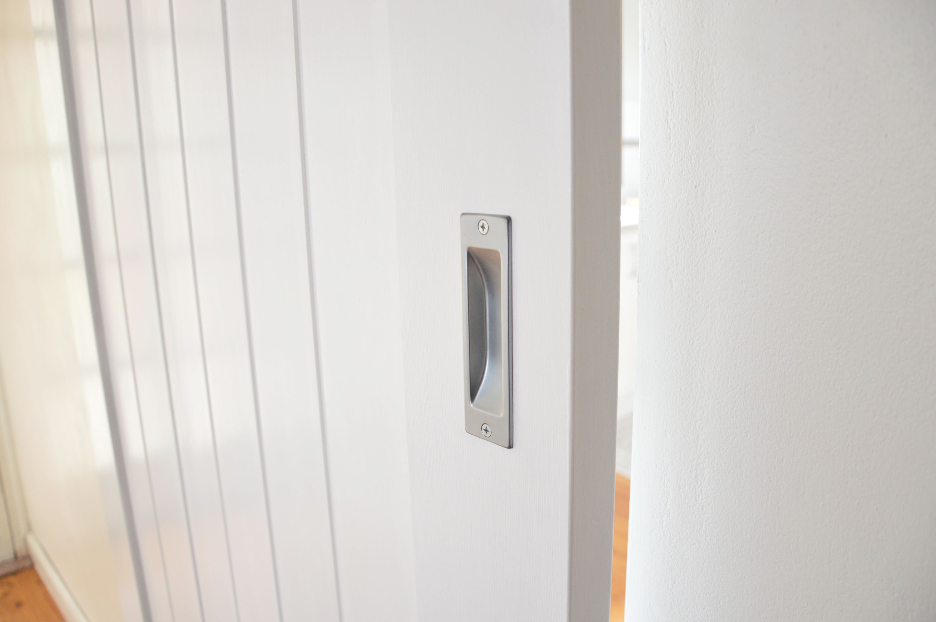 Doors-Plus-Internal-Solid-timber-Glengary-Barn-Sliding-single door-Painted white-Steel Barn tracks and fittings-close up look-flush