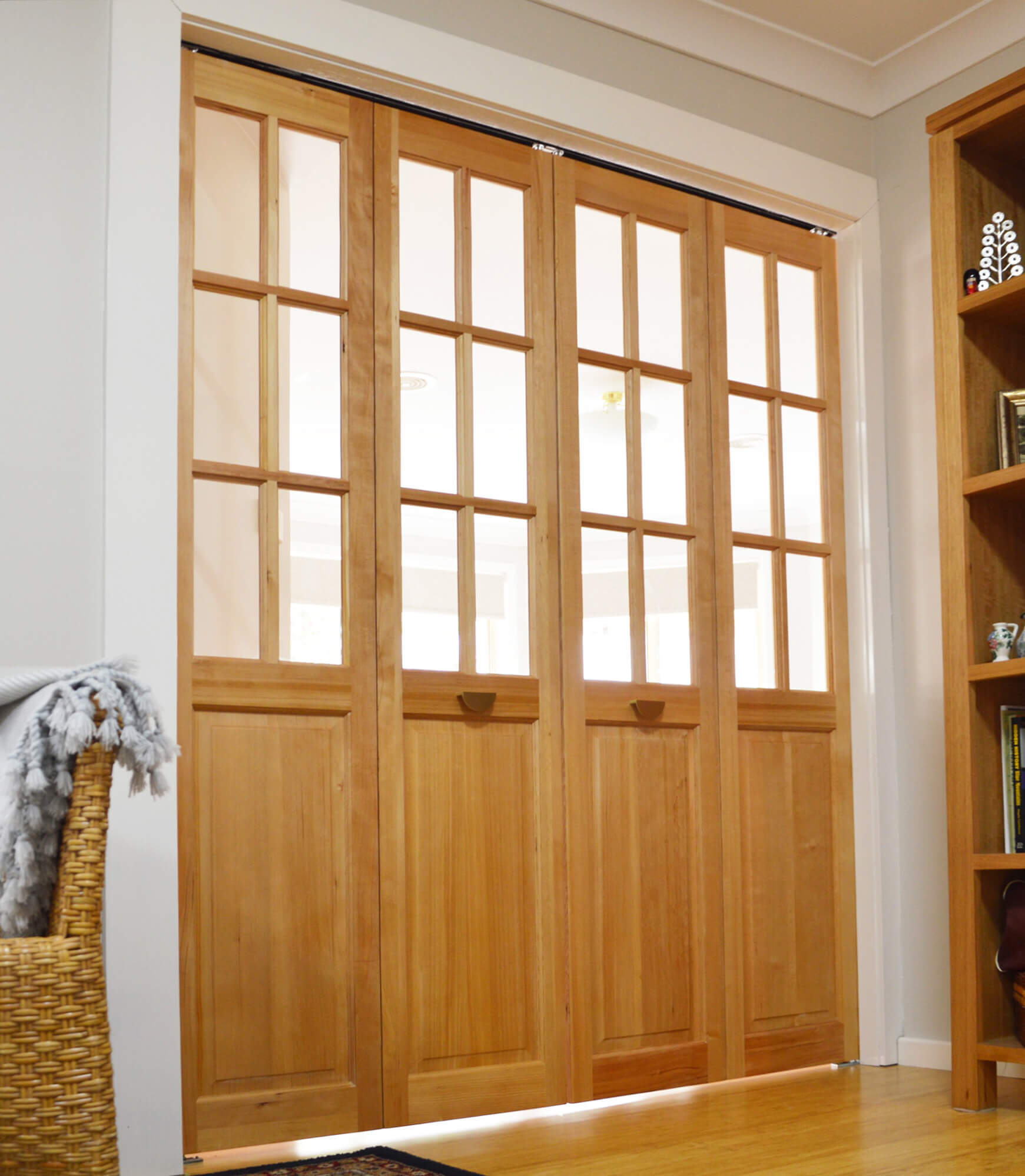 Doors Plus - 4 Panel Internal Bifolds Featuring Clear Glass in Light Maple Finish