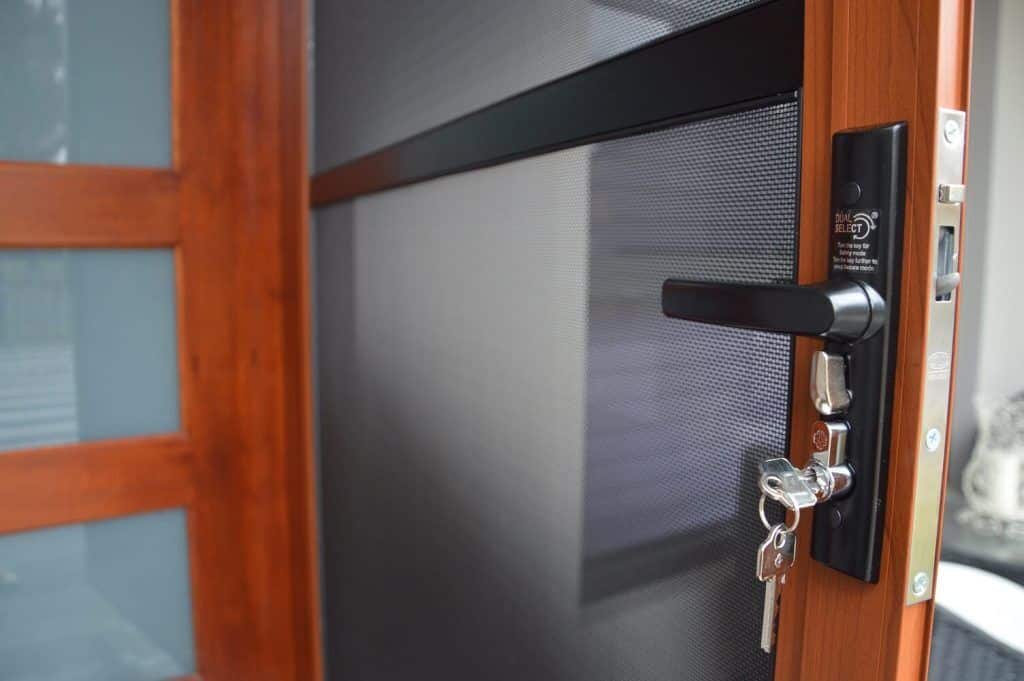 Showing a security screen door in front of an entry door 