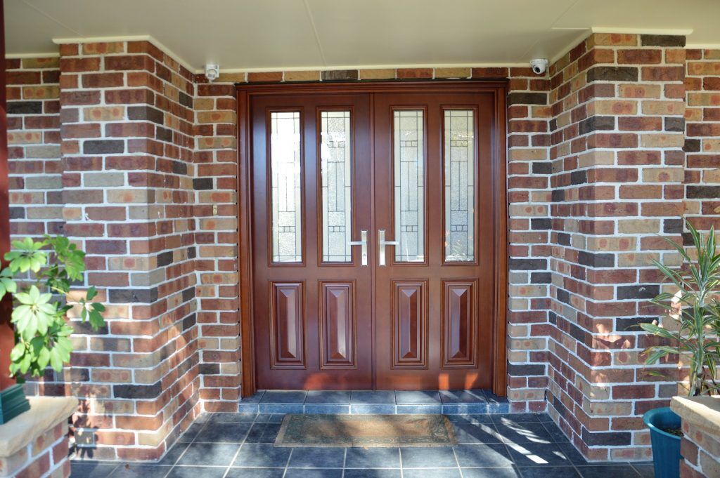double stained solid timber doors with insulsafe triple glaze decorative safeglass