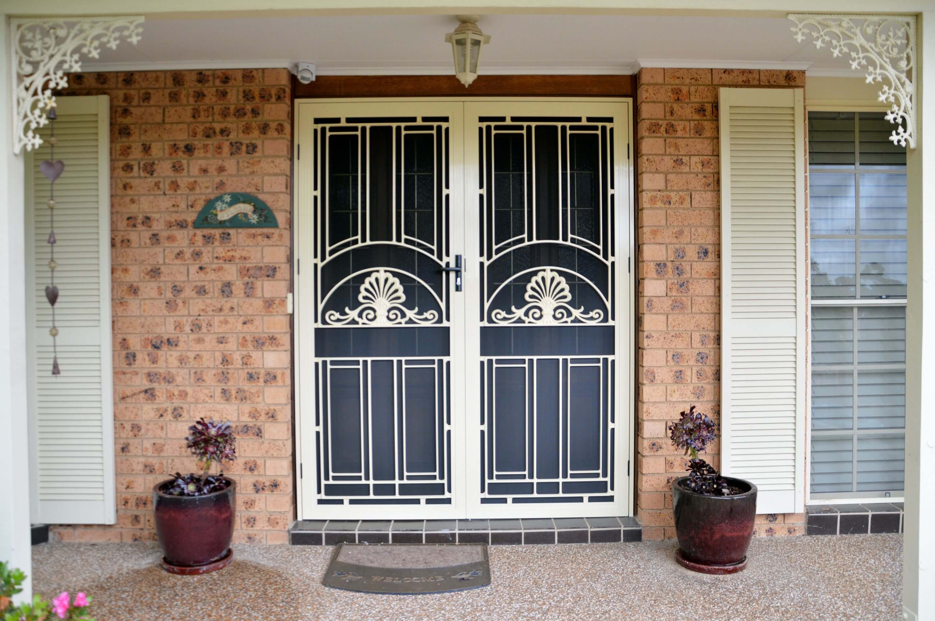Doors Plus-External-Entrance-Nubreeze-Safety screen double door-with grill design on it-in primrose finish