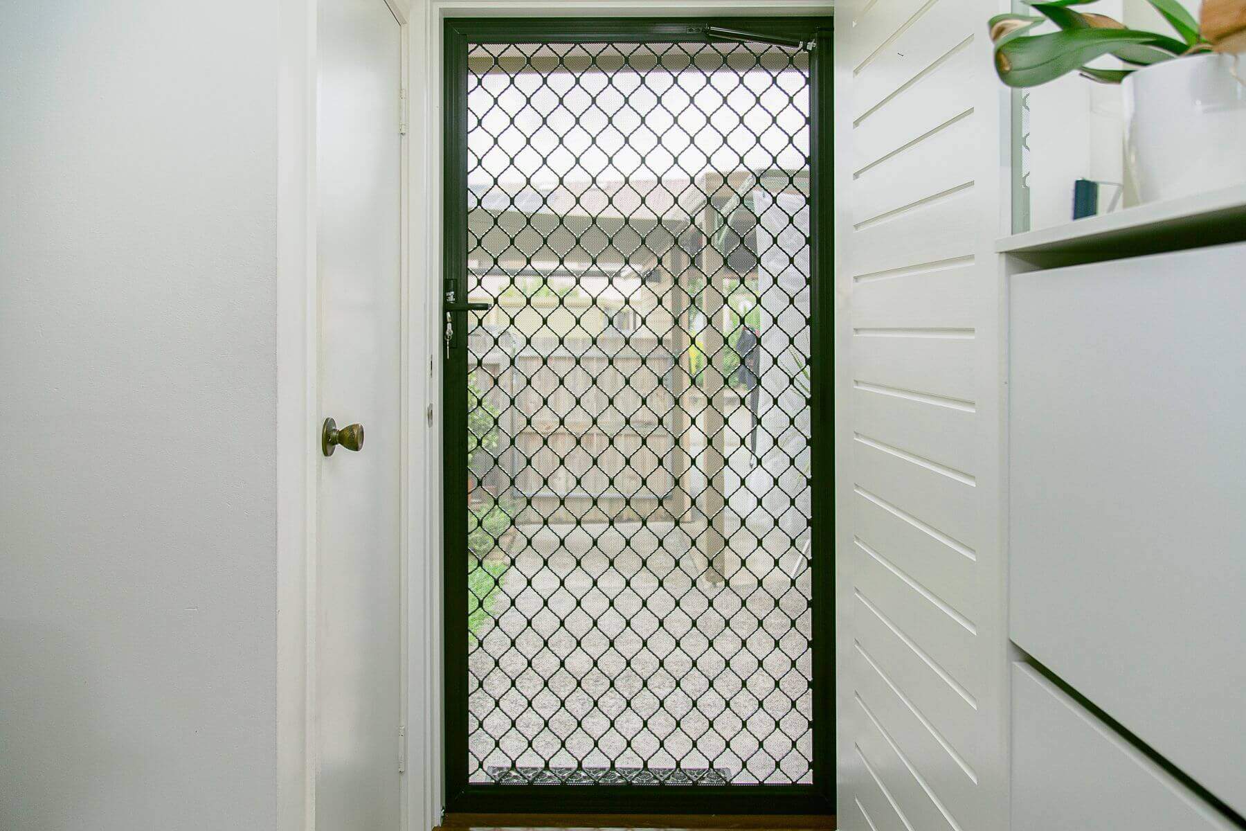 Doors Plus-External-Entrance-Nubreeze-Safety screen door-with grill design on it-in black finish