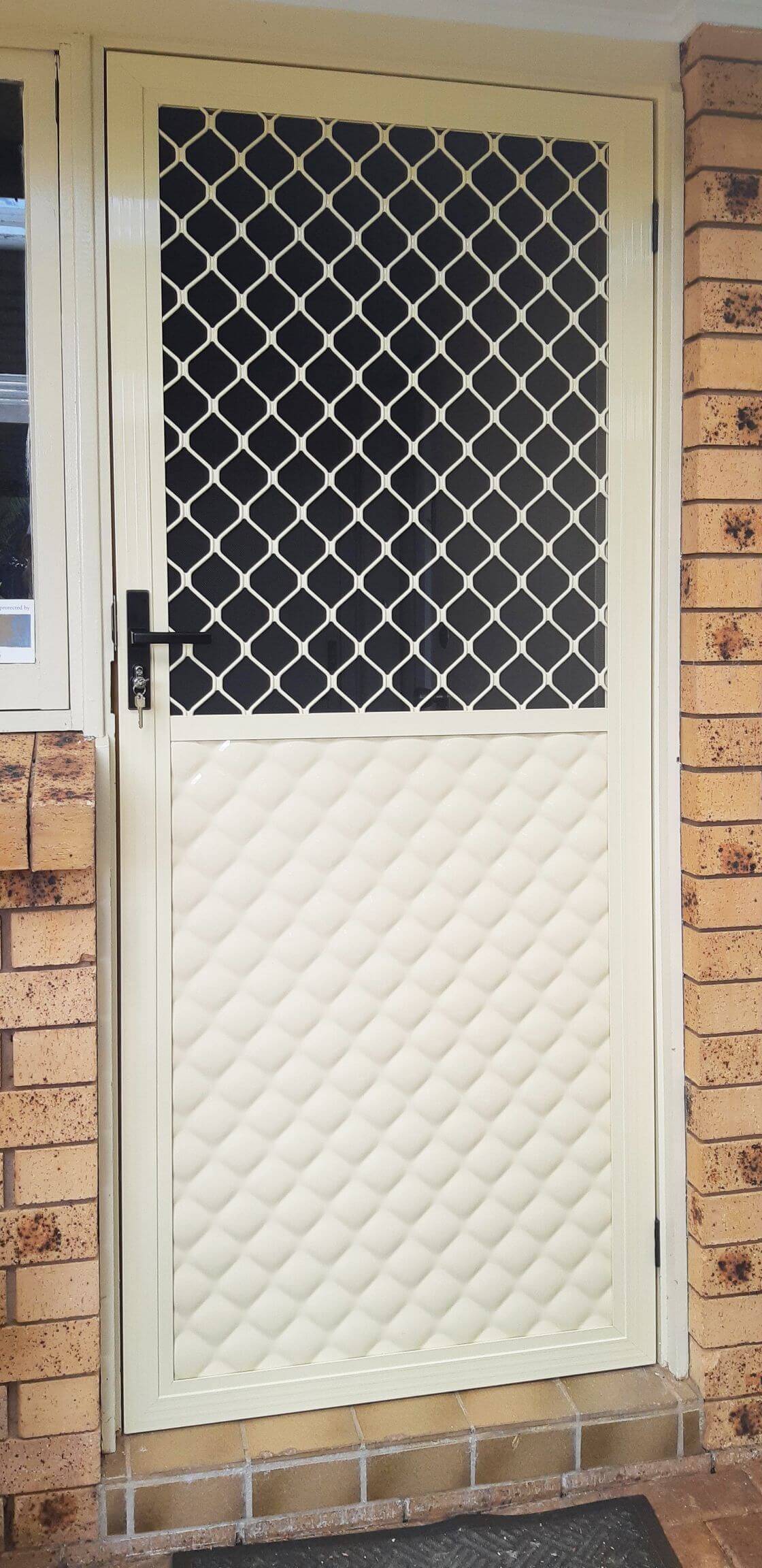 Doors Plus-External-Entrance-Nubreeze-Safety screen door with grill design on it-in primrose finish