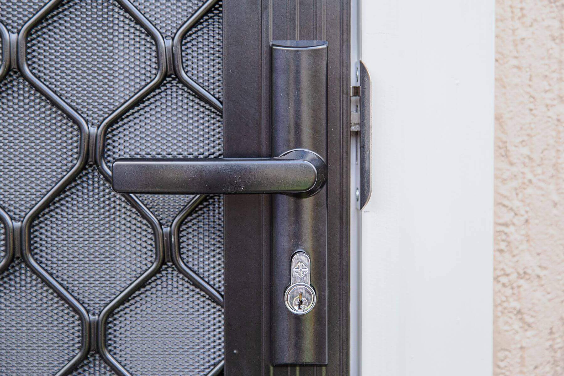 Doors Plus-External-Entrance-Nubreeze-Safety screen door-with grill design on it-in black finish-locking mechanism
