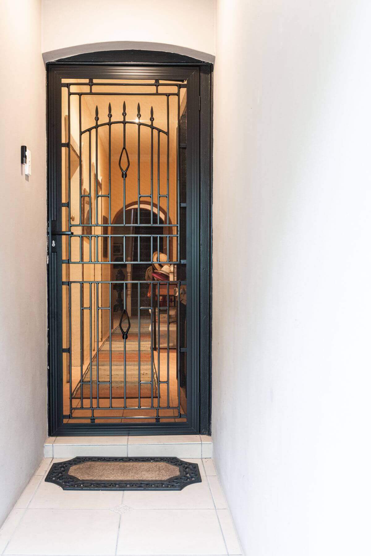 Doors Plus-External-Entrance-Nubreeze-Safety screen door-with grill design on it-in black finish-with hardware