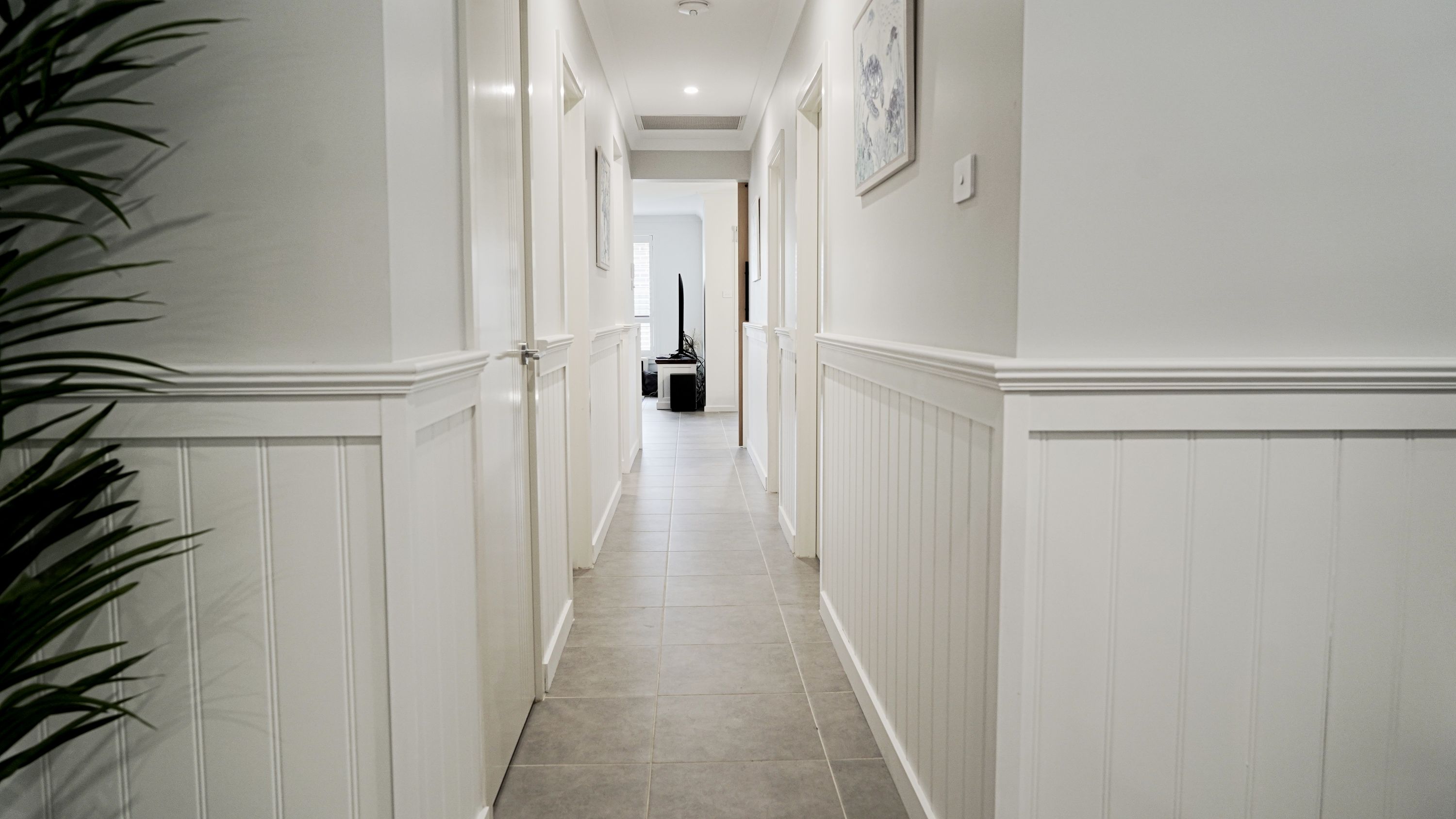 Wainscoting painted white in hallway
