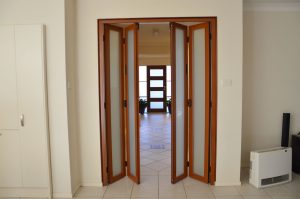 Bifold Internal Custom Door in Dark Maple Finish