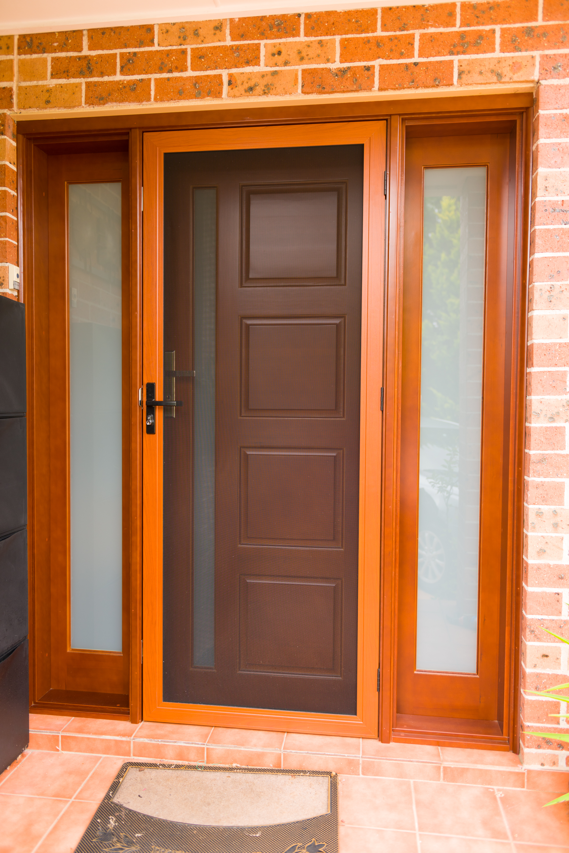 Doors Plus - Ultrasafe Security Door in Woodgrain finish