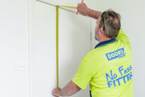 Doors Plus - Installer Measuring Height of the Door