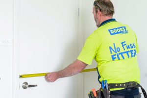 Doors Plus - Installer Measuring Width of the Door
