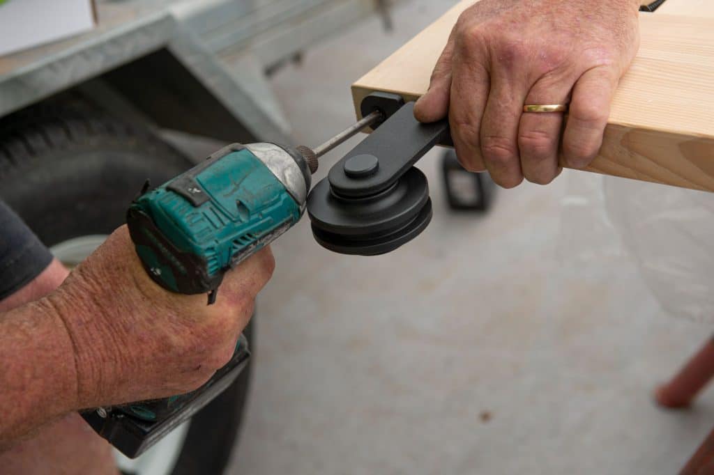 Doors Plus - Installer Fixing Rollers for Barn Track