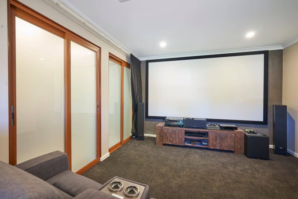 Doors Plus - Internal Aluminium Sliding Doors in Media Room with Translucent Glass