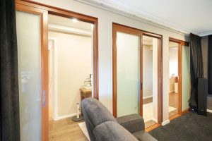 Doors Plus - Sliding Doors with Translucent Glazing in Media Room