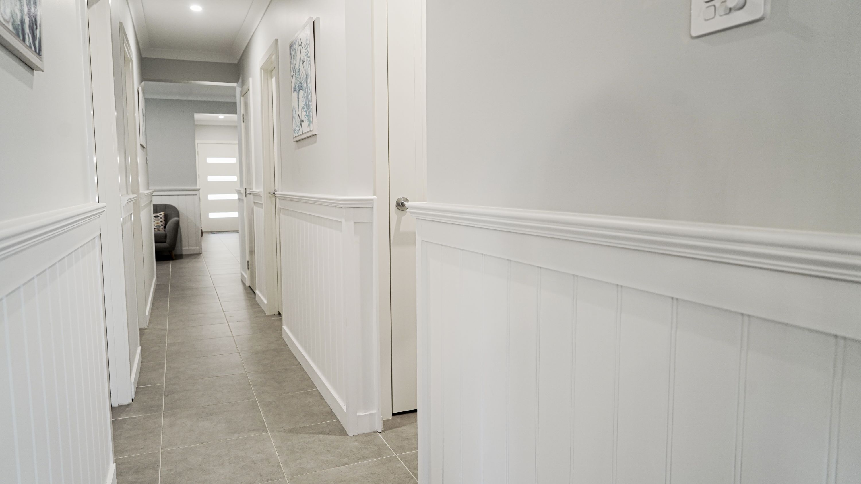 Doors Plus - Wainscoting - Hallway leading to Bedrooms and Front Door