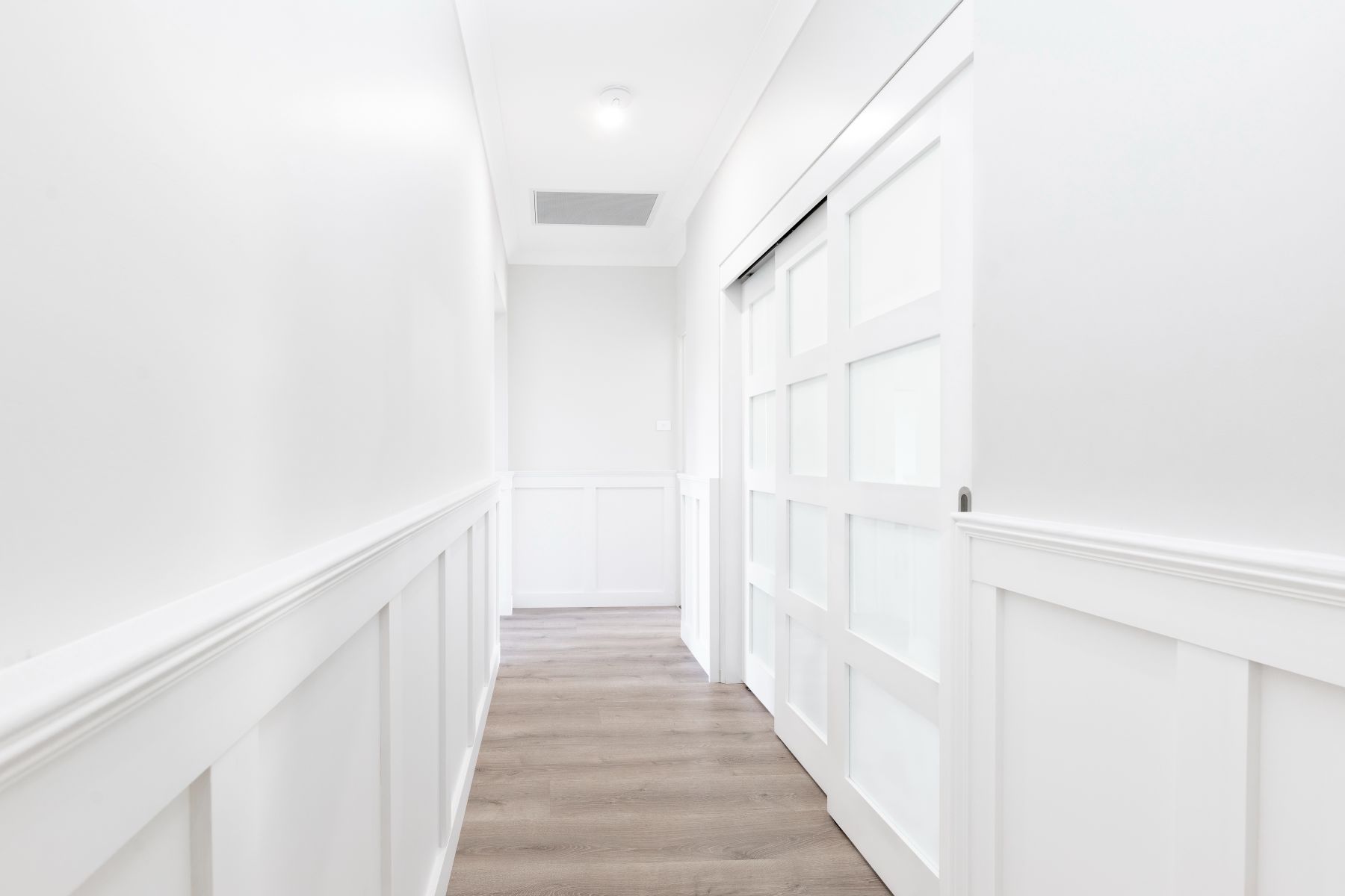 Doors Plus - Wainscoting - Hallway leading to Home Office