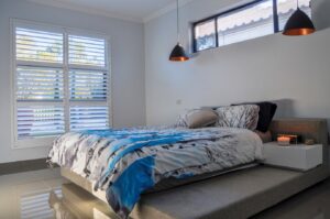 Doors Plus - Double Panel Shutters in the Bedroom