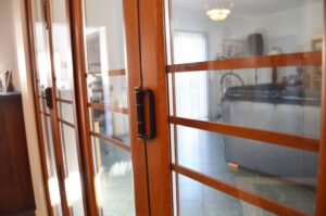 Doors Plus - Aluminium Bifold Doors - Woodgrain Finish - Clear Glass
