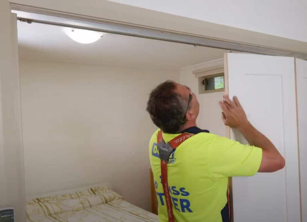 Doors Plus - Installer fixing the bifold door