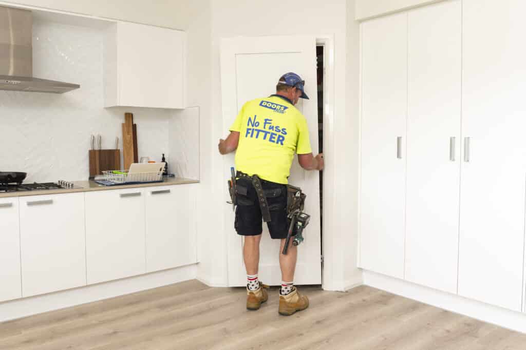 Doors Plus - Installer installing internal door