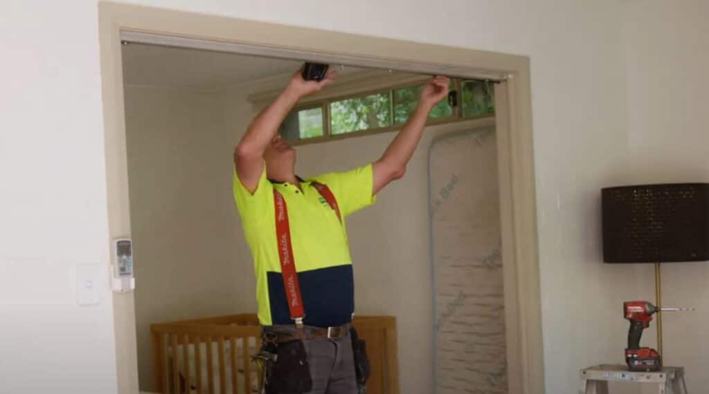 Doors Plus - Installer measuring the door