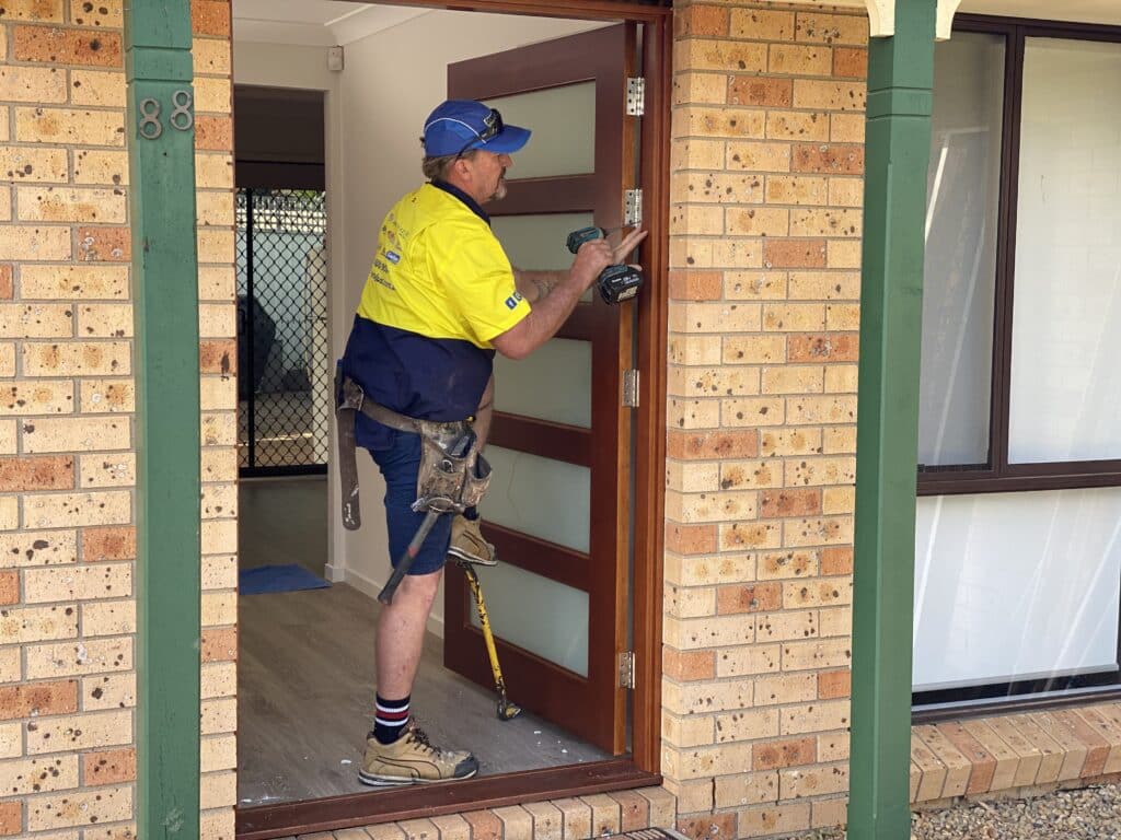 Doors Plus - Installer installing new door