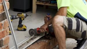 Doors Plus - Fitter Cutting Aluminium Frame