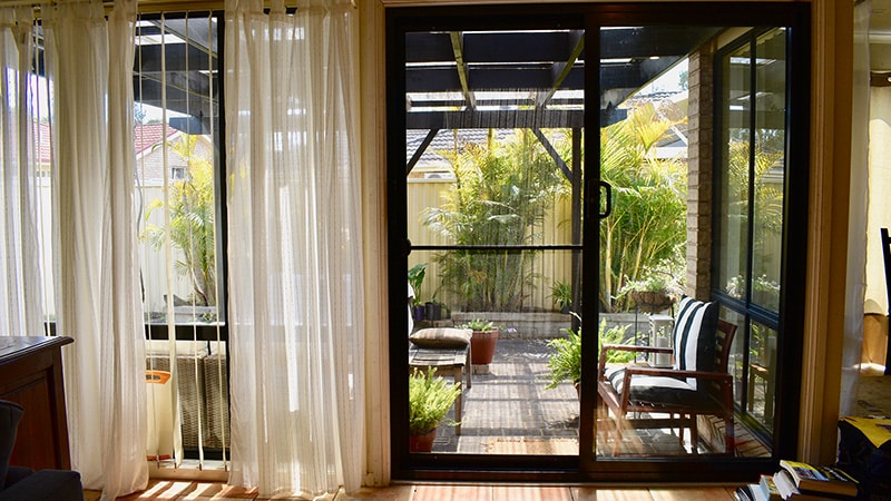 Doors Plus - Sliding Door in Backyard - Black - Small