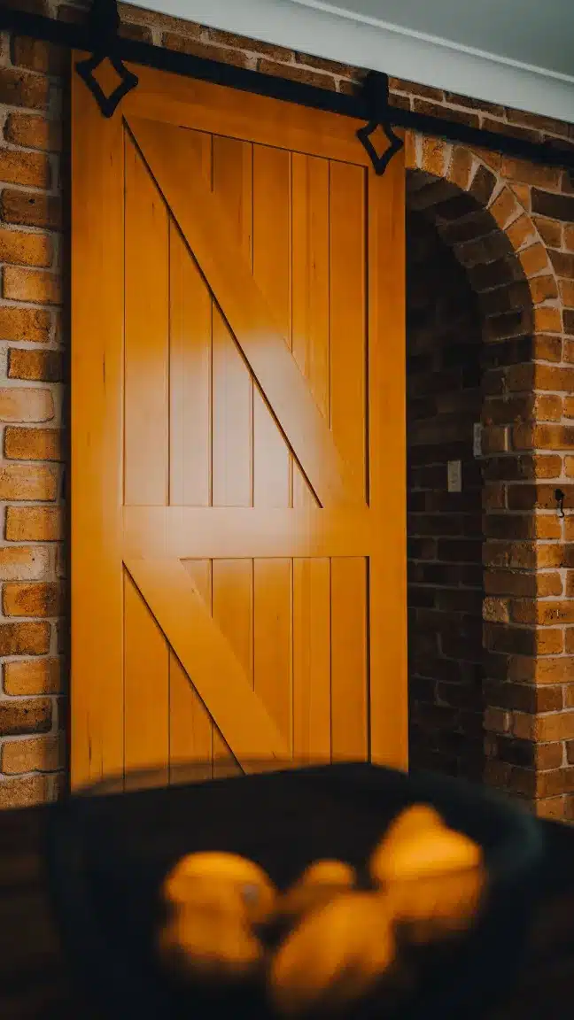 Doors Plus Internal Gelngary Barn Sliding single door Stained in light Maple with Black Barn long Tracks for your living room open