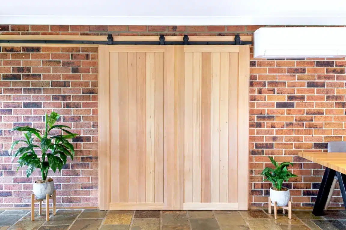 Doors Plus Internal Solid timber Glengary Barn Sliding Double door with clear stain on Black Barn long wide tracks and fittings closed